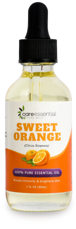 a bottle of orange essential oil