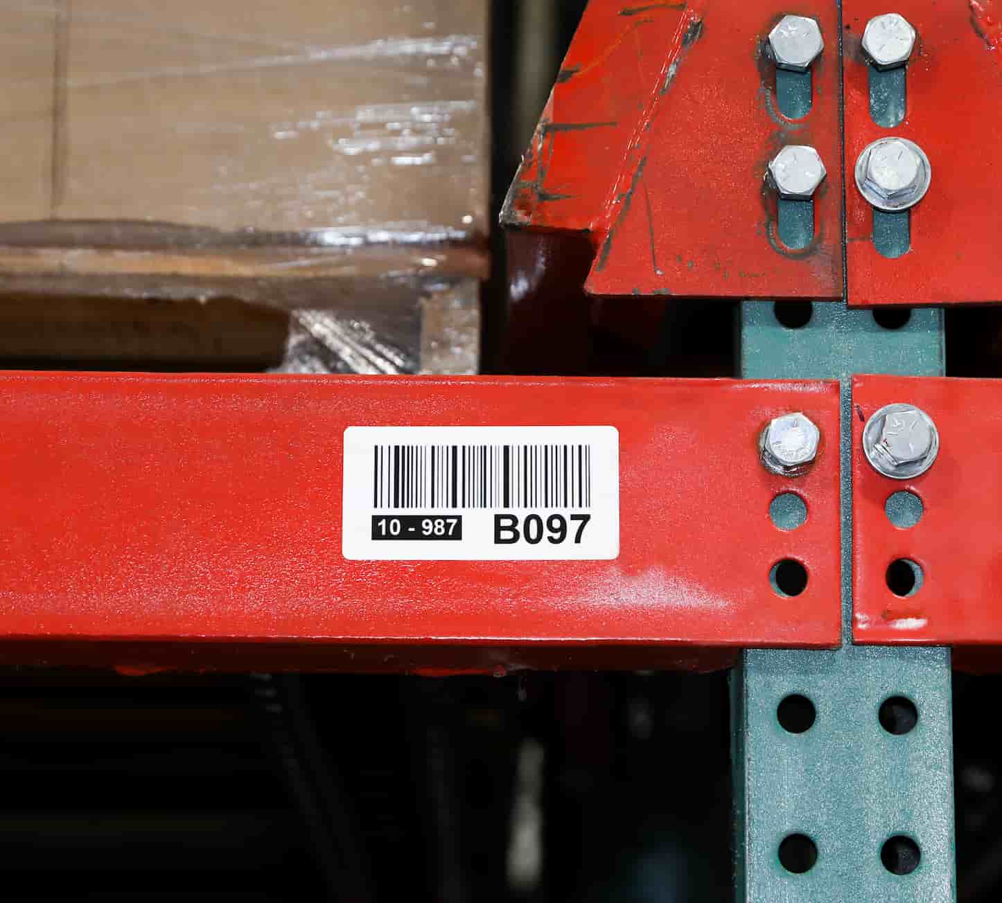 a label on a racking shelf in a warehouse
