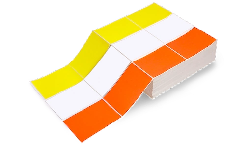 two stacks of fanfold labels