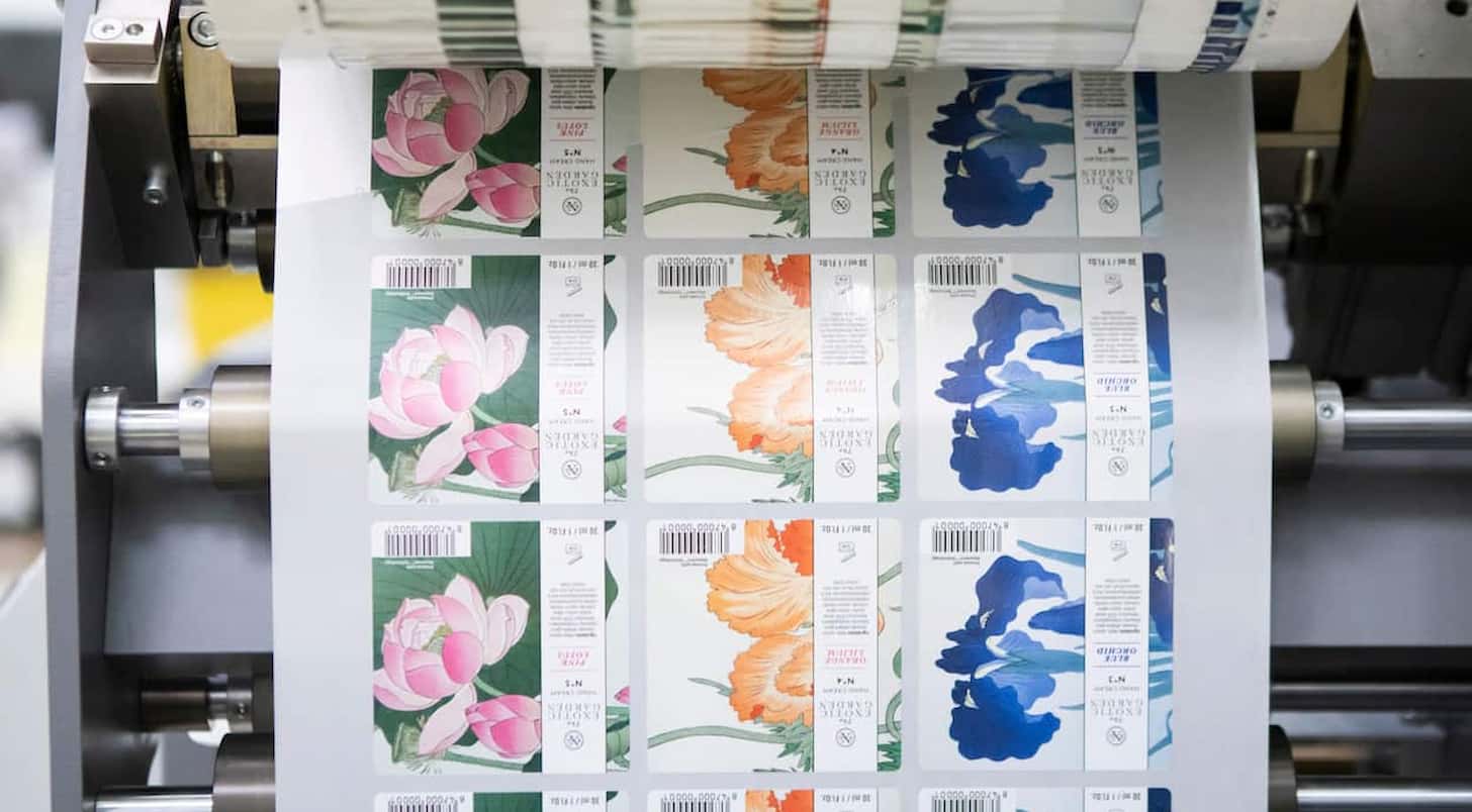 a roll of labels going into a Bobst Digital Master Printing Press