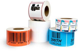An assortment of preprinted label rolls including battery labels and traditional barcode labels