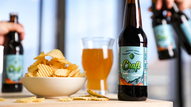 a labeled dropper on top of a pile of orange slices and leaves