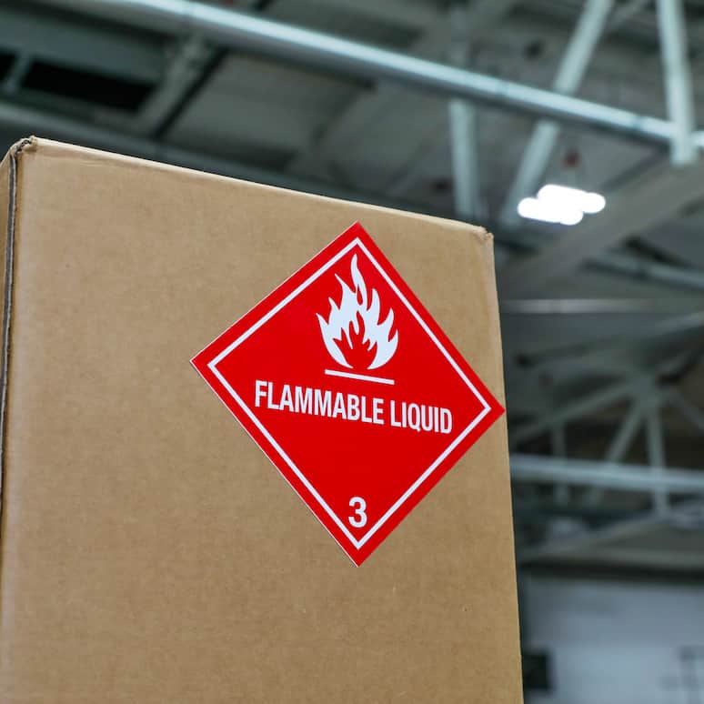 a cardboard box with a flammable liquid label
