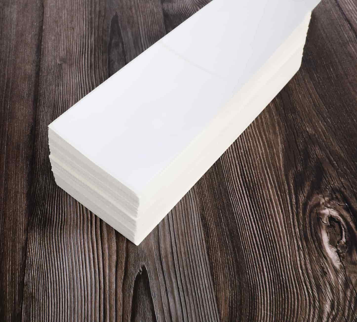 a stack of blank fanfold labels