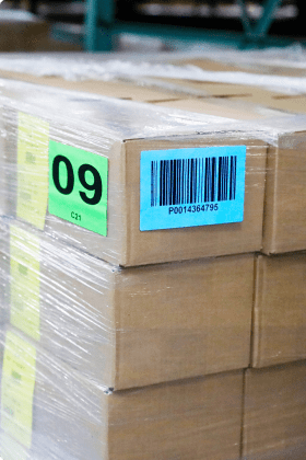 A shrink wrapped pallet of cardboard boxes