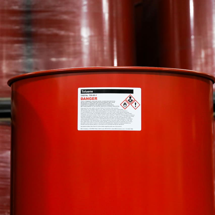 a drum of toulene with a dangerous chemical label