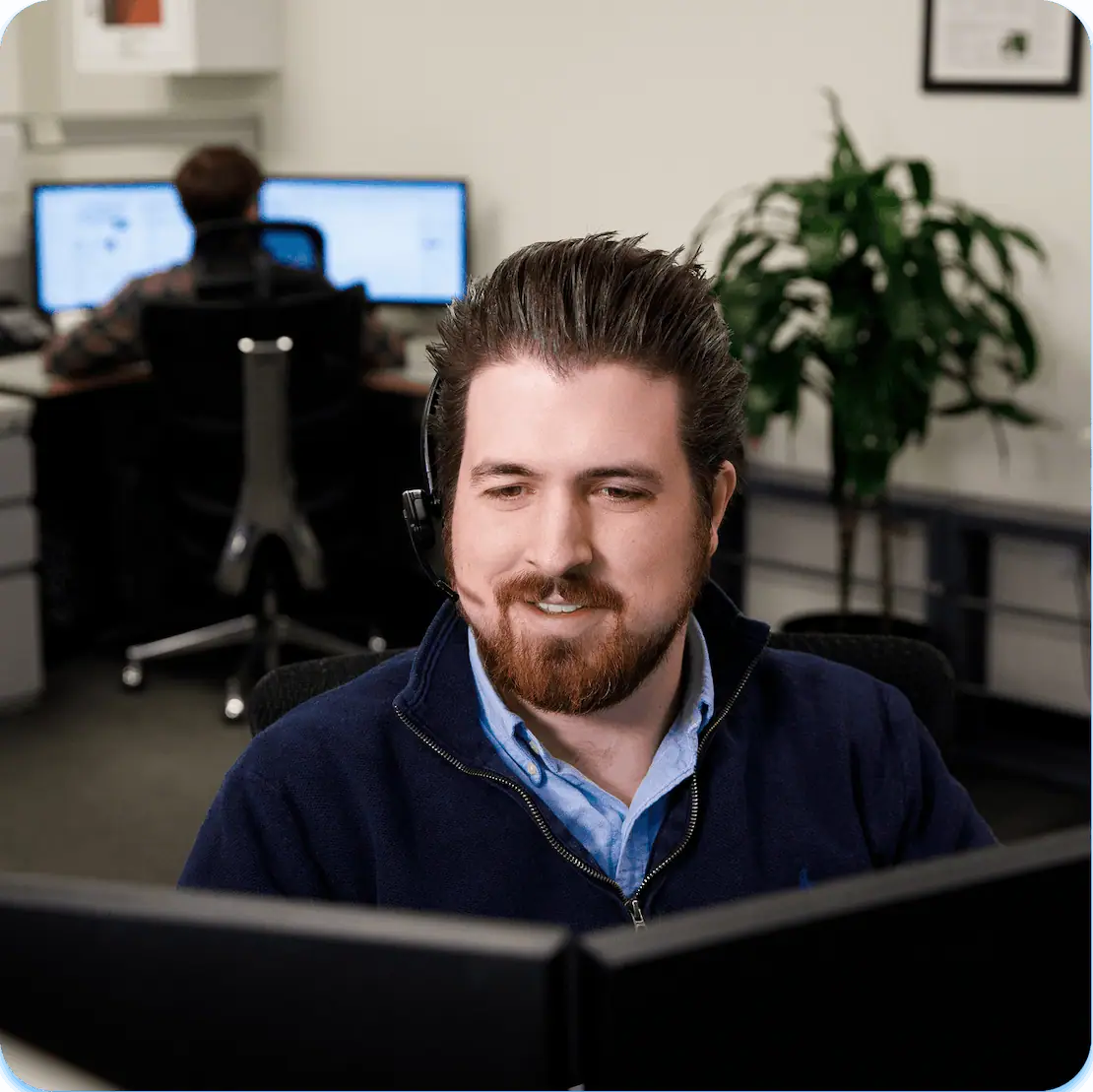 a Smith Corona employee in an office providing customer support