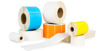 a pile of blank roll labels