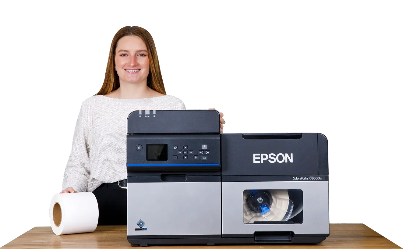 a woman stands behing a blank roll and and epson printer sitting on a table