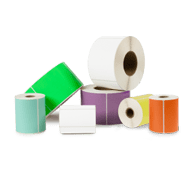 an assortment of blank roll labels sitting on top of each other